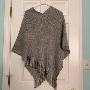 Gray and white poncho sweater.